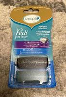 Front view of Amope Pedi Perfect Refill pack showing one regular and one ultra-coarse roller head in sealed packaging.