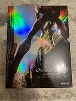 Holographic front cover of Evangelion 1.11 2-Disc Special Edition showing giant robot in cityscape with reflective rainbow colors.