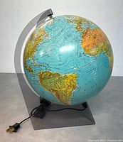 Front side view showing Atlantic Ocean with plug and base stand visible