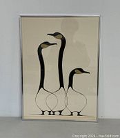 Full view of framed silkscreen print showing three stylized geese with long necks by Benjamin Chee Chee.