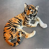 Top angle view of the tiger figurine showing overall shape, colors and paint details.