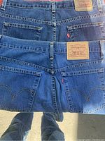 Back view of two pairs of Levi’s denim jeans showing pocket design and Levi’s branding patches.