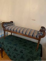 Front view of Lane vanity bench showing wooden armrests with scrolling Empire style and upholstered seat.