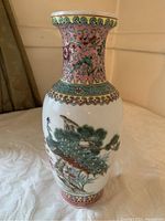 Front angle view of the vintage Chinese baluster vase showing peacock and floral hand painted design, flared rim, and detailed borders.