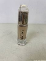 Front view of Burberry Body perfume bottle showing the golden liquid and logo on the bottle.