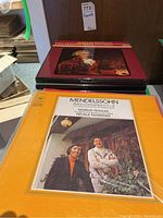 Front view of two classical music vinyl album covers; Mendelssohn Piano Concertos and a classical-themed record.