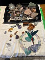 Overview of entire collection including rocks, tray and stained glass