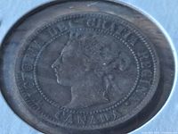 Close-up image of the obverse side of a 1899 Canadian large penny showing Queen Victoria's profile and inscription.