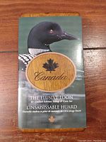 Front of the booklet with an image of the loon and text 'The Elusive Loon' in English and French, highlighting the limited edition stamp and coin set.