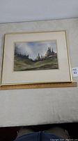 Full view of framed watercolour painting by Bob Blenderman titled 'Deep River Country', with ruler for scale showing approx 14.5 x 10.5 inch visible image area. Frame and matting visible.