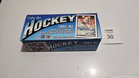 Boxed set of O-Pee-Chee 1991-92 hockey cards, showing original packaging and branding.