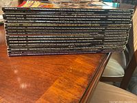 Stack of White Dwarf magazines with visible spines showing issue numbers 162 to 178 in a row on a wooden table.