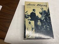 Front cover of the book 'Arctic Odyssey: The Diary of Diamond Jenness 1913-1916' showing title and historic photo images.