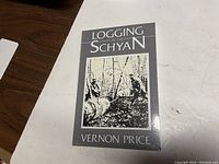 Front cover of the book showing title, author, and illustration of loggers in a forest.