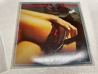 Front cover of 'No Fear' vinyl record album by Down Child showing the artistic photo of crossed legs with stockings.