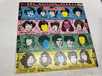 Front cover of the Some Girls album showing illustrated band member portraits and vintage styled text and graphics