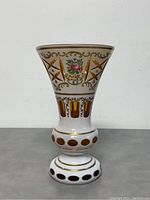 Full front view of the vase showing the hand painted floral and gold geometric pattern.