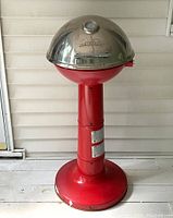 Full view of the Masterbuilt Veranda pedestal electric grill showing red base and dome lid
