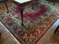 Full view under table showing central medallion and overall color scheme