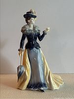 Full front view of the Elizabeth figurine showing full length, outfit details, and posture.