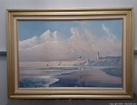 Front view of the framed art print depicting coastal lighthouse scene with seagulls and clouds.