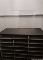 Two tempered glass shelves shown side by side lying flat, transparent with clear edges.