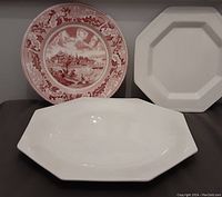 Three Johnson Brothers serving plates: one round patterned cranberry pink and white plate, two hexagon-shaped white ironstone plates.