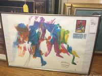 Full view of abstract elephant painting, vibrant colors, framed under glass.