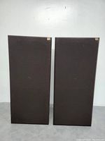 Front view with black fabric grilles installed