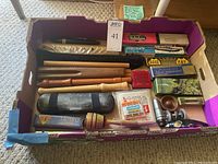 Overview of assorted instruments in purple lot box