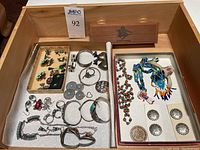 Overall lot in wooden tray showing rings, bracelets, necklaces, earrings, concho buttons and seed bead jewelry