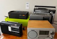 All five radios grouped for overview showing different sizes and designs