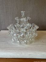 Front view of the larger cluster stacking propagation vase with 25 total vase openings, showing clear glass and circular arrangement.