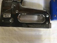 Close-up of Arrow Heavy Duty T-50M stapler model label and finish