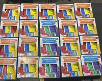 Photo showing all 20 boxes arranged in four rows of five boxes each, with visible colors red, blue, yellow, green, purple, and white.