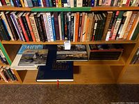 Bookshelves filled with books on Middle Eastern history, politics, Islamic studies, Canadian encyclopedias and local Kingston history books.