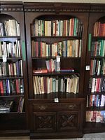 Full front view showing two shelves, single drawer and cabinet doors.