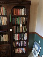 Full view of six-shelf bookcase loaded with books