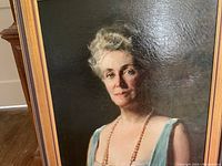 Close-up of woman's face in oil painting showing brushwork and detail