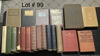 Photo of 17 vintage hardcover books arranged in a grid with visible wear on covers and spines.
