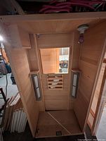 Front view of interior showing wood paneling, glass window and two infrared heater panels