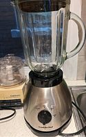 Franklin Chef blender with glass pitcher on stainless steel base and control dial on front.