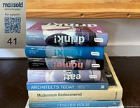 Stack of books including 'Drink!', 'Relax!', 'Home!', 'Eat!', 'Architects Today', 'Modernism Rediscovered', 'English House'