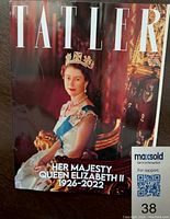 Cover of Tatler magazine featuring Queen Elizabeth II in regal attire with crown and sash, showing dates 1926-2022 and title 'HER MAJESTY QUEEN ELIZABETH II'.