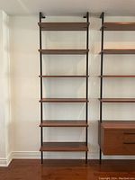 Full front view of shelving unit showing all six shelves and frame.