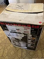 Cardboard shipping box labeled KitchenAid 5 Qt mixer