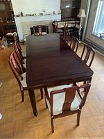 Overall view of table and chairs assembled in room