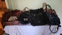 Photo of assorted vintage purses showing various sizes and conditions