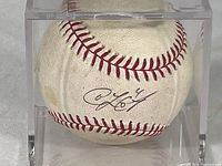 Close-up of the signed panel of the baseball showing Coco Crisp's autograph inside a clear plexiglass case.