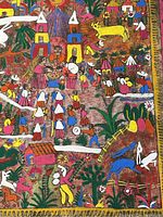 Close-up detail showing colorful hand-painted figures, animals, and village elements on fibrous paper.